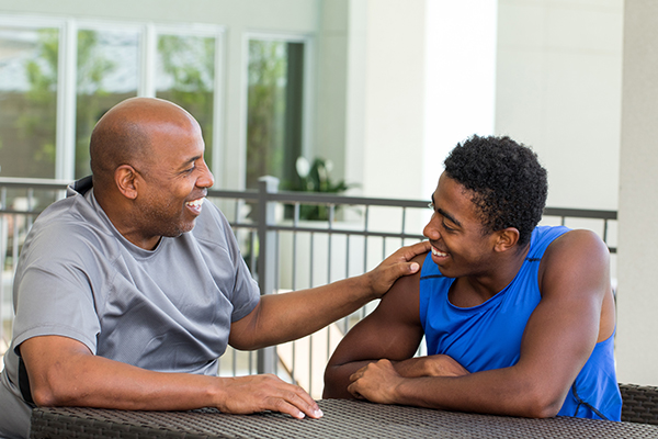 A father talking to a college son.
