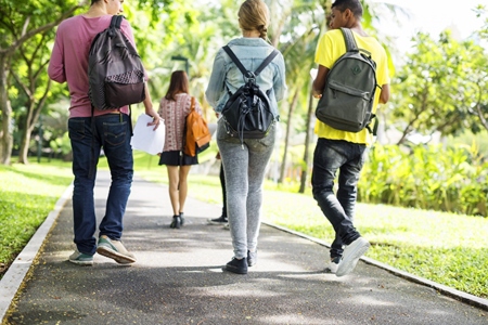 College students walking in the park.